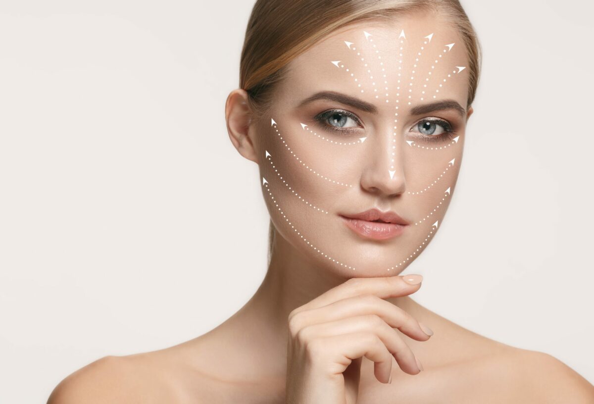 The Advantages of Using Diamond Glow Facial for Skin Rejuvenation 9 Portrait Of Beautiful Woman's Perfect Skin With Arrows On Face | Skyler Soares Skin Clinic in Scottsdale, AZ